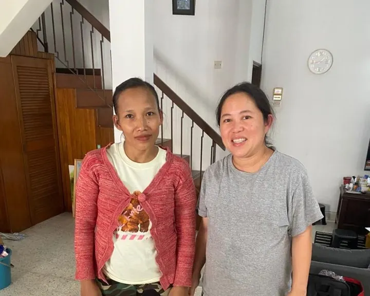 Ms. Ng with her helper at home