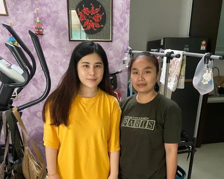 Ms. Yuan with her helper at home